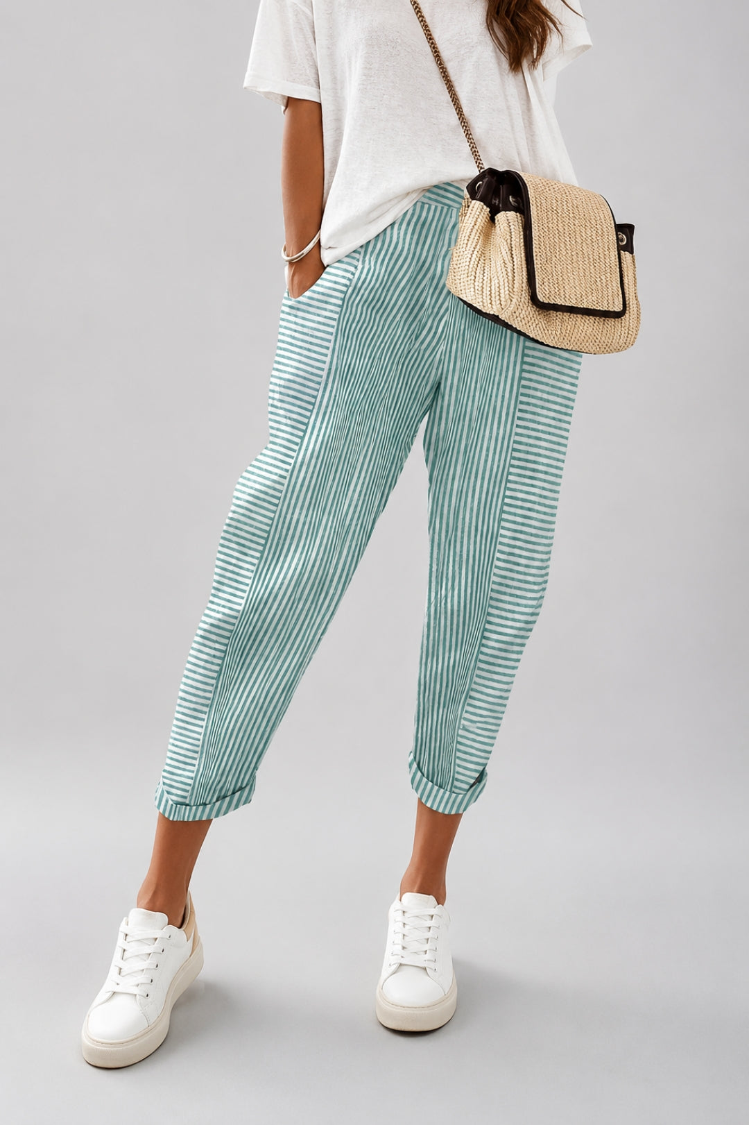 Women's linen pants with stripes and a trendy, close-fitting ankle cut