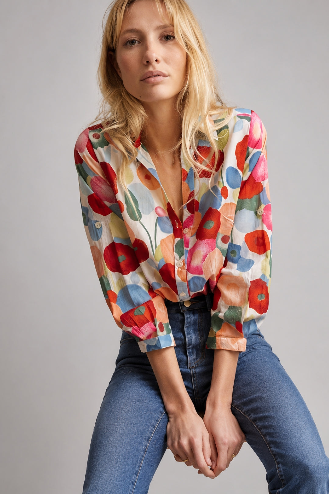 Women's boho-style linen blouse with a colorful floral pattern, V-neck, and long sleeves